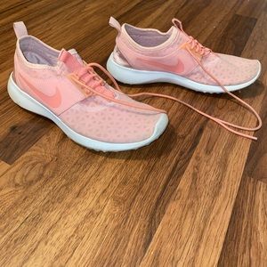 Pink women’s Nike running shoes